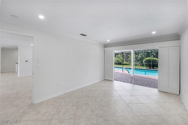 750 Southern Pines Dr, Naples, FL 34103 - empty room with ornamental molding, light tile patterned flooring, baseboards, and recessed lighting