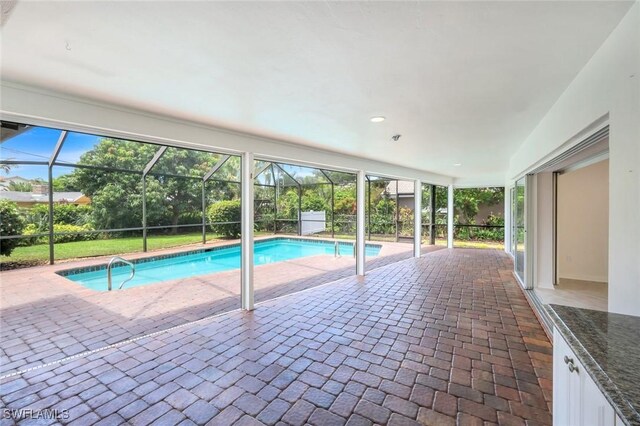 750 Southern Pines Dr, Naples, FL 34103 - outdoor pool with a patio and glass enclosure
