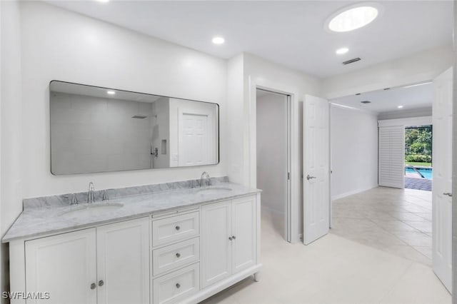 750 Southern Pines Dr, Naples, FL 34103 - full bath featuring a shower, double vanity, recessed lighting, and baseboards