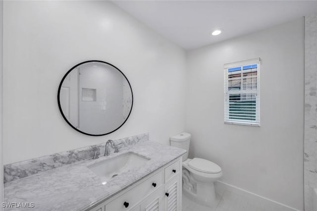 750 Southern Pines Dr, Naples, FL 34103 - bathroom featuring toilet, vanity, baseboards, and tile patterned floors