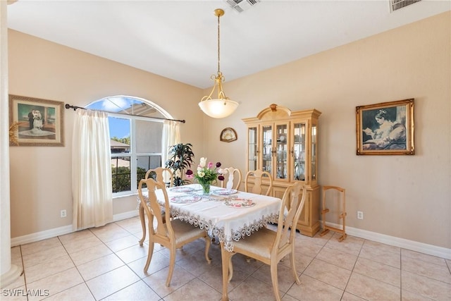 dining area with light tile patterned flooring, baseboards, and visible vents