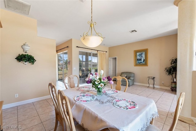 dining area featuring light tile patterned floors and visible vents
