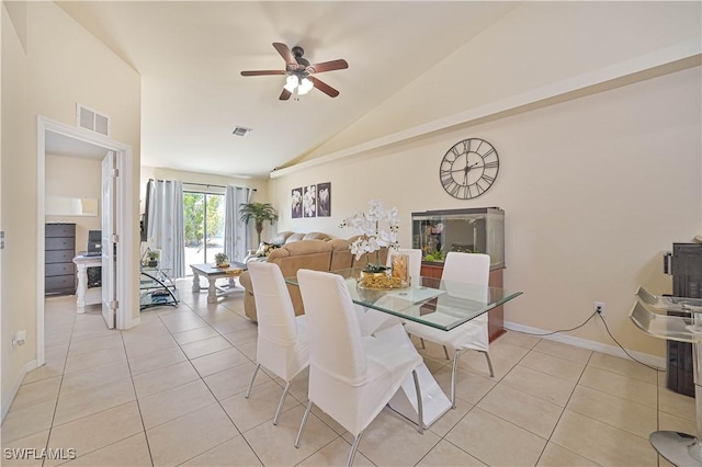 dining room featuring light tile patterned flooring, visible vents, ceiling fan, and lofted ceiling