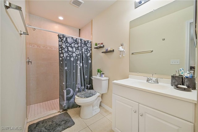 bathroom with visible vents, a tile shower, tile patterned floors, toilet, and vanity