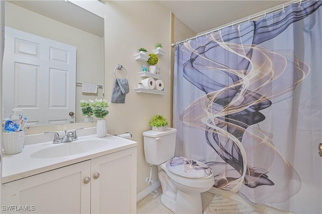 bathroom featuring toilet, vanity, baseboards, and a shower with shower curtain