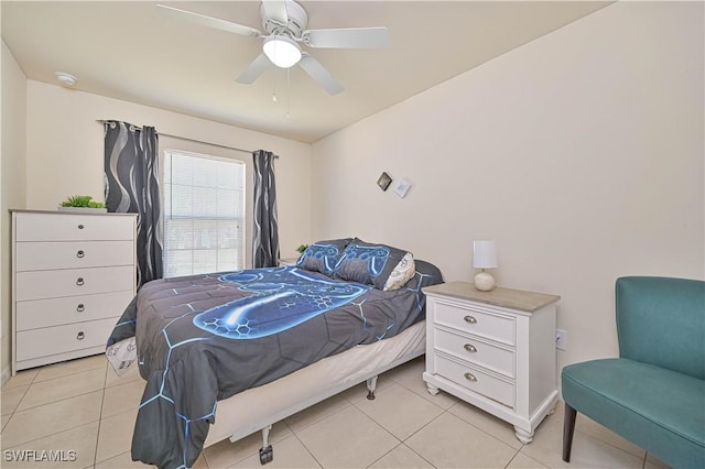 bedroom with a ceiling fan and light tile patterned floors