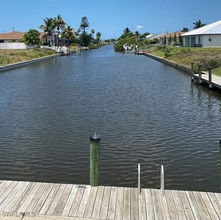 dock area with a water view