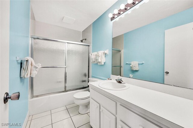 827 E Gulf Dr Unit K8, Sanibel, FL 33957 - full bath with tile patterned floors, vanity, toilet, and enclosed tub / shower combo