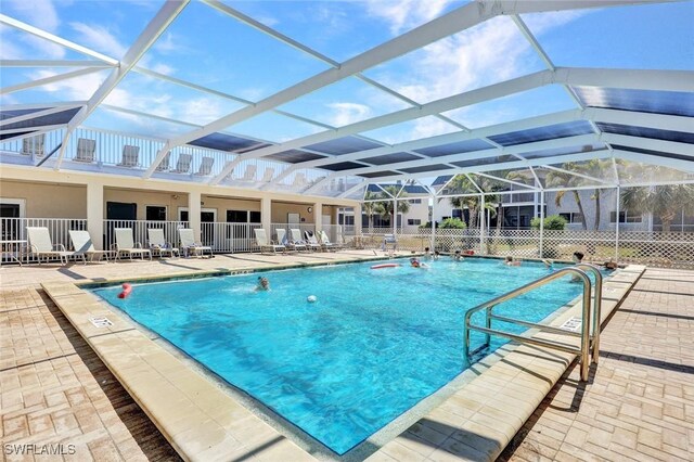 827 E Gulf Dr Unit K8, Sanibel, FL 33957 - community pool featuring a lanai, fence, and a patio