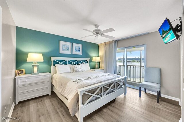 827 E Gulf Dr Unit K8, Sanibel, FL 33957 - bedroom featuring baseboards, access to exterior, wood finished floors, and a ceiling fan