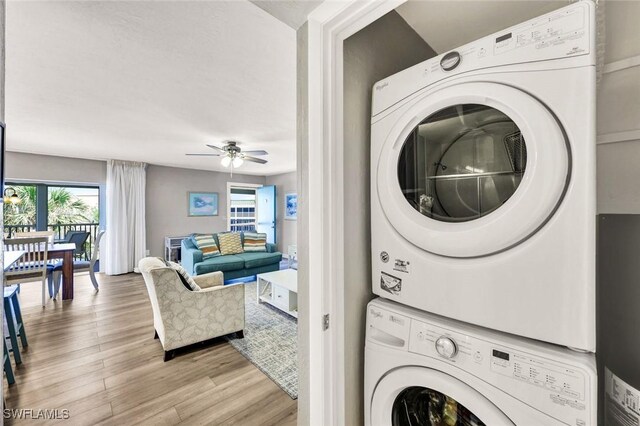 827 E Gulf Dr Unit K8, Sanibel, FL 33957 - laundry room with laundry area, stacked washer and dryer, light wood finished floors, and ceiling fan