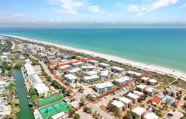 aerial view featuring a water view and a beach view
