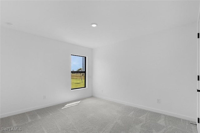 1621 NW 7th Ter, Cape Coral, FL 33993 - unfurnished room with light carpet and baseboards