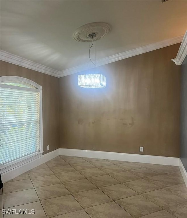 3012 10th St W, Lehigh Acres, FL 33971 - tiled empty room with baseboards and ornamental molding