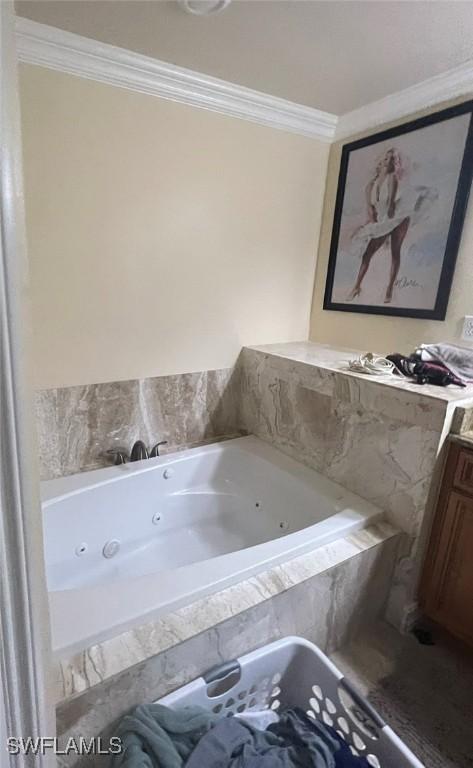 3012 10th St W, Lehigh Acres, FL 33971 - full bathroom featuring crown molding, vanity, and a jetted tub