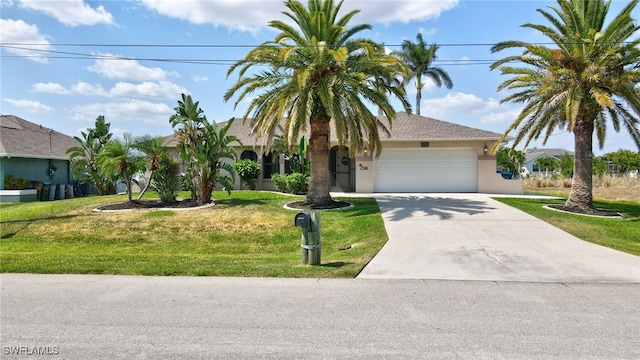 423 SE 17th St, Cape Coral, FL 33990 - view of front of home with stucco siding, concrete driveway, a front lawn, and a garage