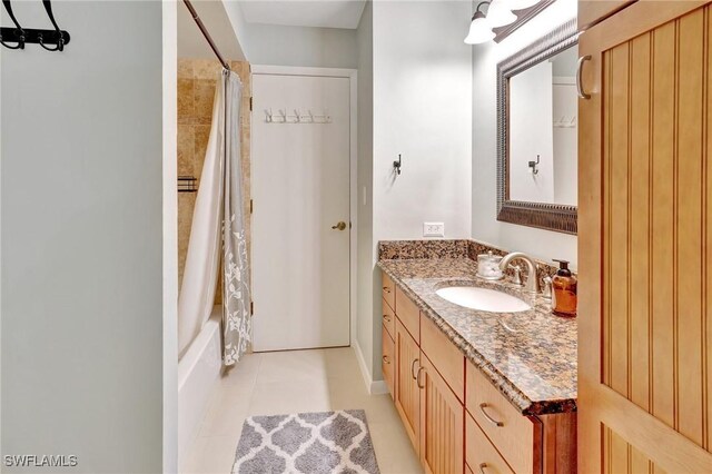 423 SE 17th St, Cape Coral, FL 33990 - bathroom with tile patterned floors, shower / tub combo with curtain, and vanity