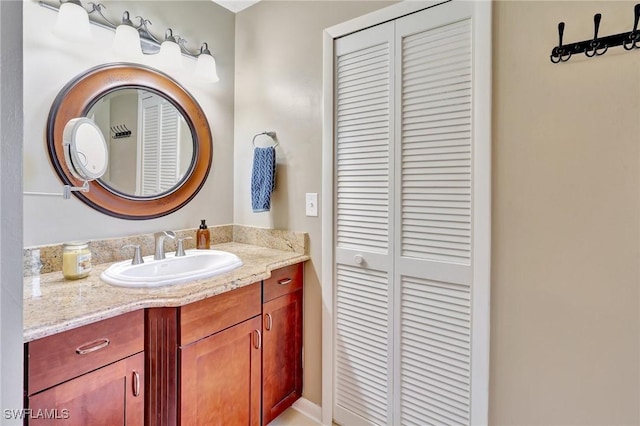 423 SE 17th St, Cape Coral, FL 33990 - bathroom with a closet and vanity