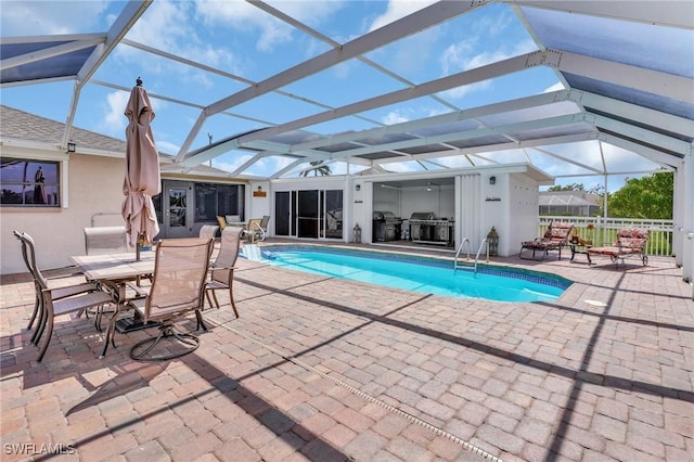 423 SE 17th St, Cape Coral, FL 33990 - pool featuring a patio, outdoor dining space, glass enclosure, and area for grilling