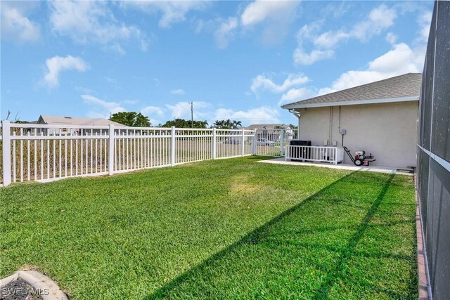 423 SE 17th St, Cape Coral, FL 33990 - view of yard featuring a fenced backyard and a patio area