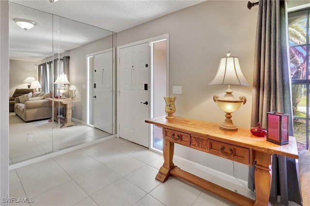 423 SE 17th St, Cape Coral, FL 33990 - entryway with a textured ceiling and light tile patterned floors