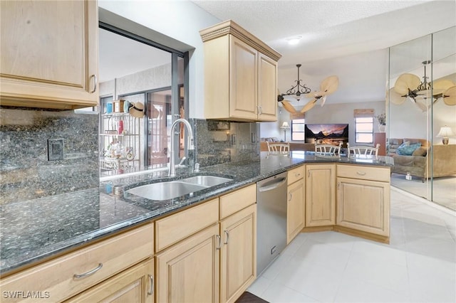 423 SE 17th St, Cape Coral, FL 33990 - kitchen featuring stainless steel dishwasher, an inviting chandelier, light brown cabinetry, a sink, and open floor plan