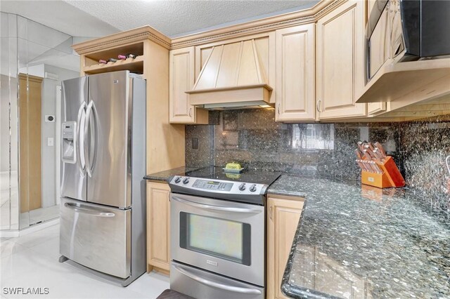 423 SE 17th St, Cape Coral, FL 33990 - kitchen featuring light brown cabinetry, custom exhaust hood, stainless steel appliances, and backsplash