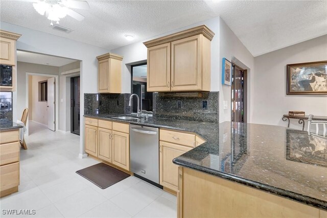 423 SE 17th St, Cape Coral, FL 33990 - kitchen featuring tasteful backsplash, stainless steel dishwasher, light brown cabinets, a sink, and a ceiling fan
