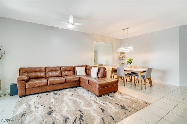 9150 Southmont Cv Unit 203, Fort Myers, FL 33908 - living area with baseboards, a ceiling fan, and light tile patterned floors
