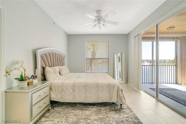 9150 Southmont Cv Unit 203, Fort Myers, FL 33908 - bedroom with light tile patterned floors, access to outside, and ceiling fan