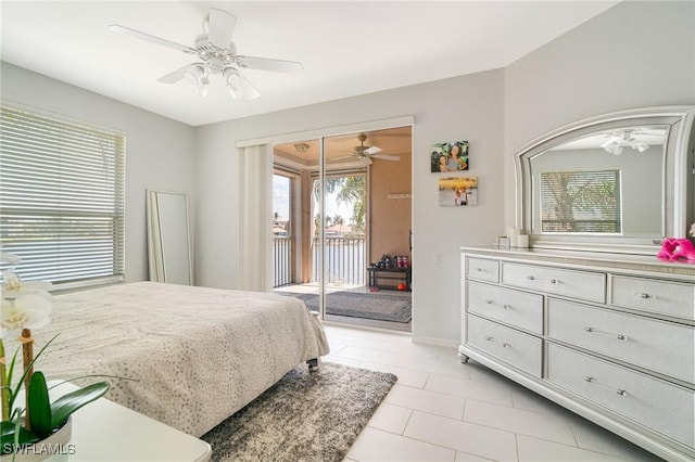 9150 Southmont Cv Unit 203, Fort Myers, FL 33908 - bedroom with access to exterior, ceiling fan, and light tile patterned floors
