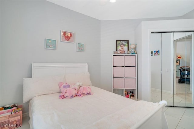 9150 Southmont Cv Unit 203, Fort Myers, FL 33908 - bedroom with light tile patterned floors and a closet