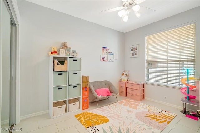 9150 Southmont Cv Unit 203, Fort Myers, FL 33908 - game room with a ceiling fan, tile patterned floors, and baseboards