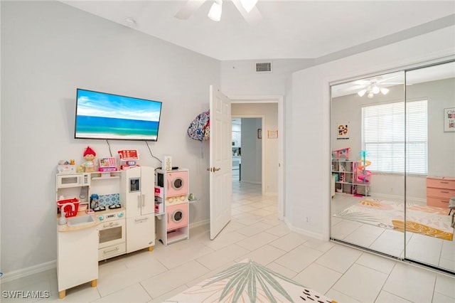 9150 Southmont Cv Unit 203, Fort Myers, FL 33908 - recreation room featuring baseboards, visible vents, ceiling fan, and light tile patterned floors