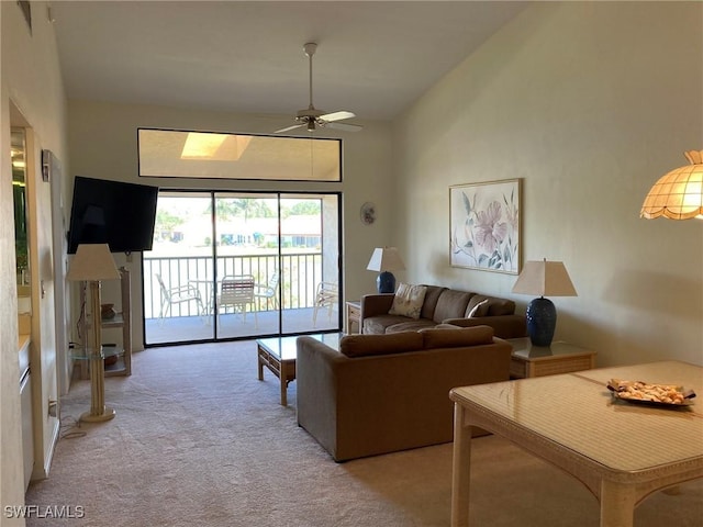 13111 Cross Creek Blvd SE Unit 215, Fort Myers, FL 33912 - carpeted living room featuring a ceiling fan and lofted ceiling