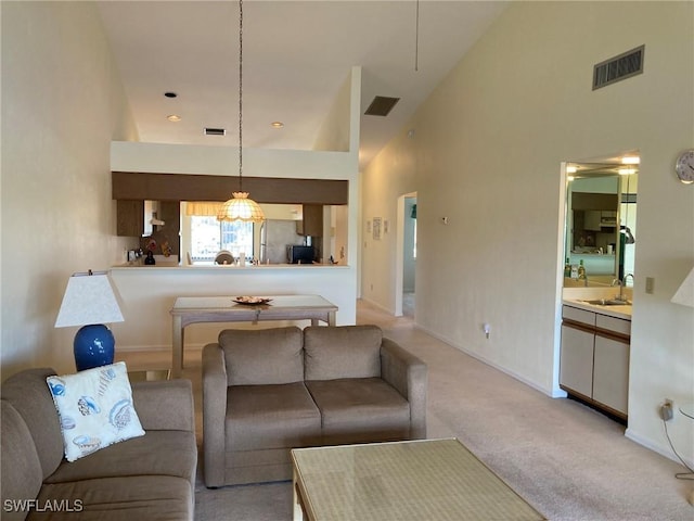 13111 Cross Creek Blvd SE Unit 215, Fort Myers, FL 33912 - living area featuring light carpet and a towering ceiling