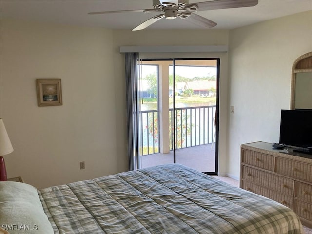 13111 Cross Creek Blvd SE Unit 215, Fort Myers, FL 33912 - carpeted bedroom with access to exterior and ceiling fan