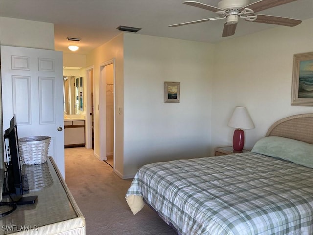 13111 Cross Creek Blvd SE Unit 215, Fort Myers, FL 33912 - bedroom with light carpet and ceiling fan