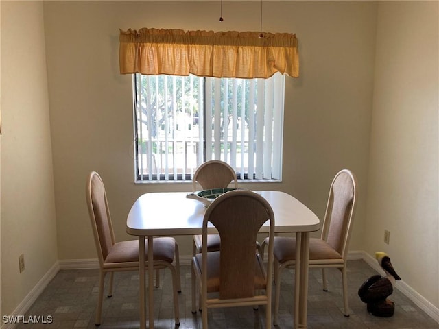 13111 Cross Creek Blvd SE Unit 215, Fort Myers, FL 33912 - dining room featuring baseboards
