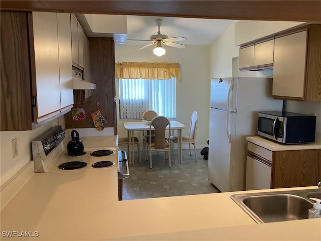 13111 Cross Creek Blvd SE Unit 215, Fort Myers, FL 33912 - kitchen featuring electric stove, stainless steel microwave, under cabinet range hood, light countertops, and ceiling fan