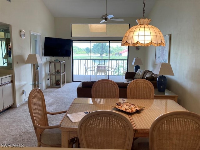 13111 Cross Creek Blvd SE Unit 215, Fort Myers, FL 33912 - dining area featuring light carpet and ceiling fan