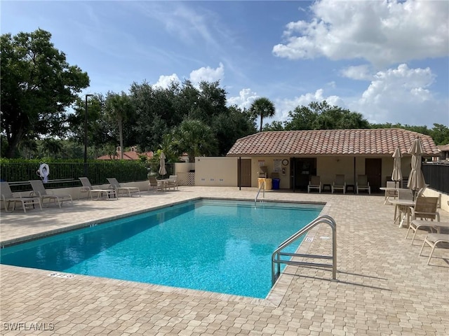 13111 Cross Creek Blvd SE Unit 215, Fort Myers, FL 33912 - community pool with a patio