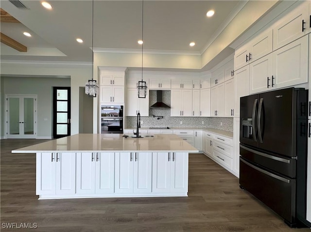 kitchen featuring white cabinetry, crown molding, black appliances, wall chimney exhaust hood, and a sink
