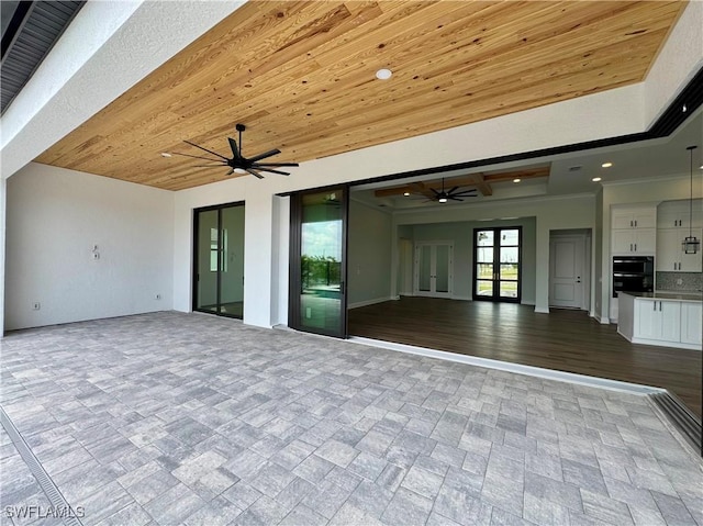 exterior space featuring ceiling fan