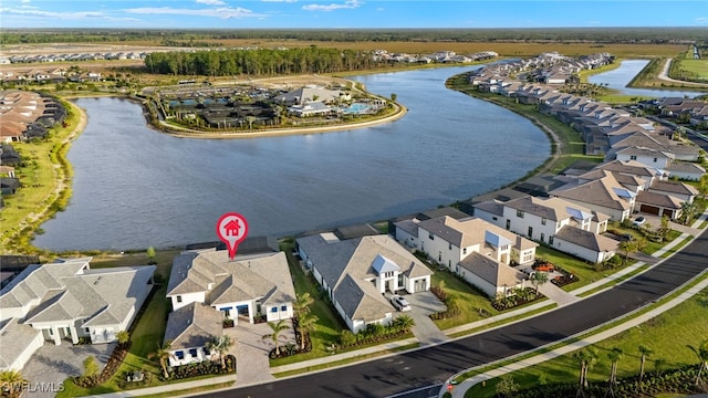 bird's eye view with a water view and a residential view