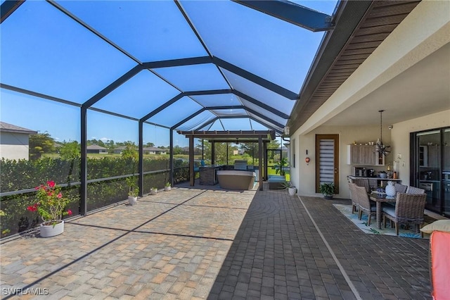 view of patio featuring a lanai