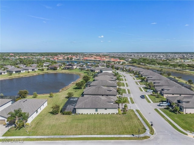 aerial view featuring a residential view and a water view