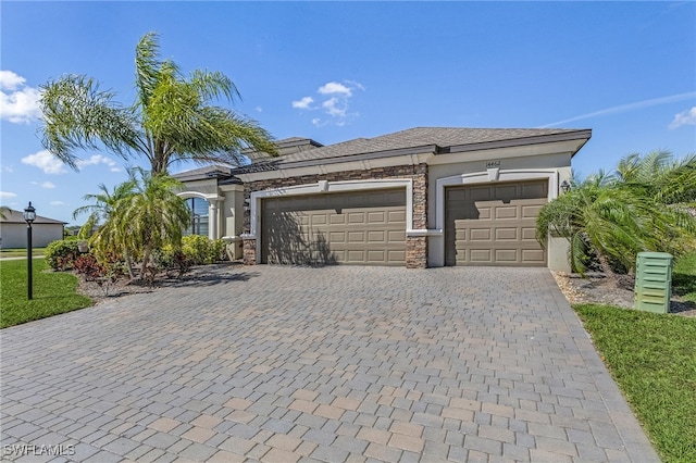 garage featuring decorative driveway