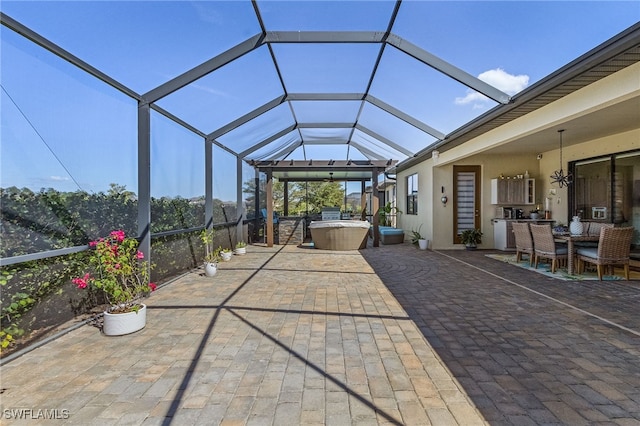 view of patio / terrace featuring glass enclosure and an outdoor hangout area
