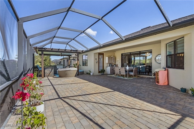 view of patio / terrace featuring outdoor dining space and a lanai